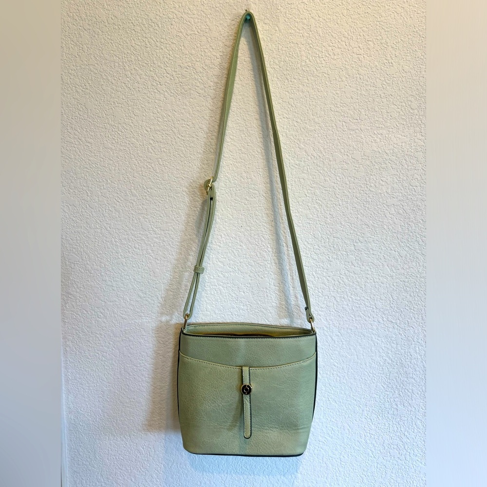 Mint green crossbody purse with leopard print interior
